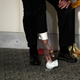 U.S. Senate Majority Leader Mitch McConnell reaches to get a dropped face mask as he talks to the media after the Republican policy luncheon on Capitol Hill in Washington on October 20, 2020.